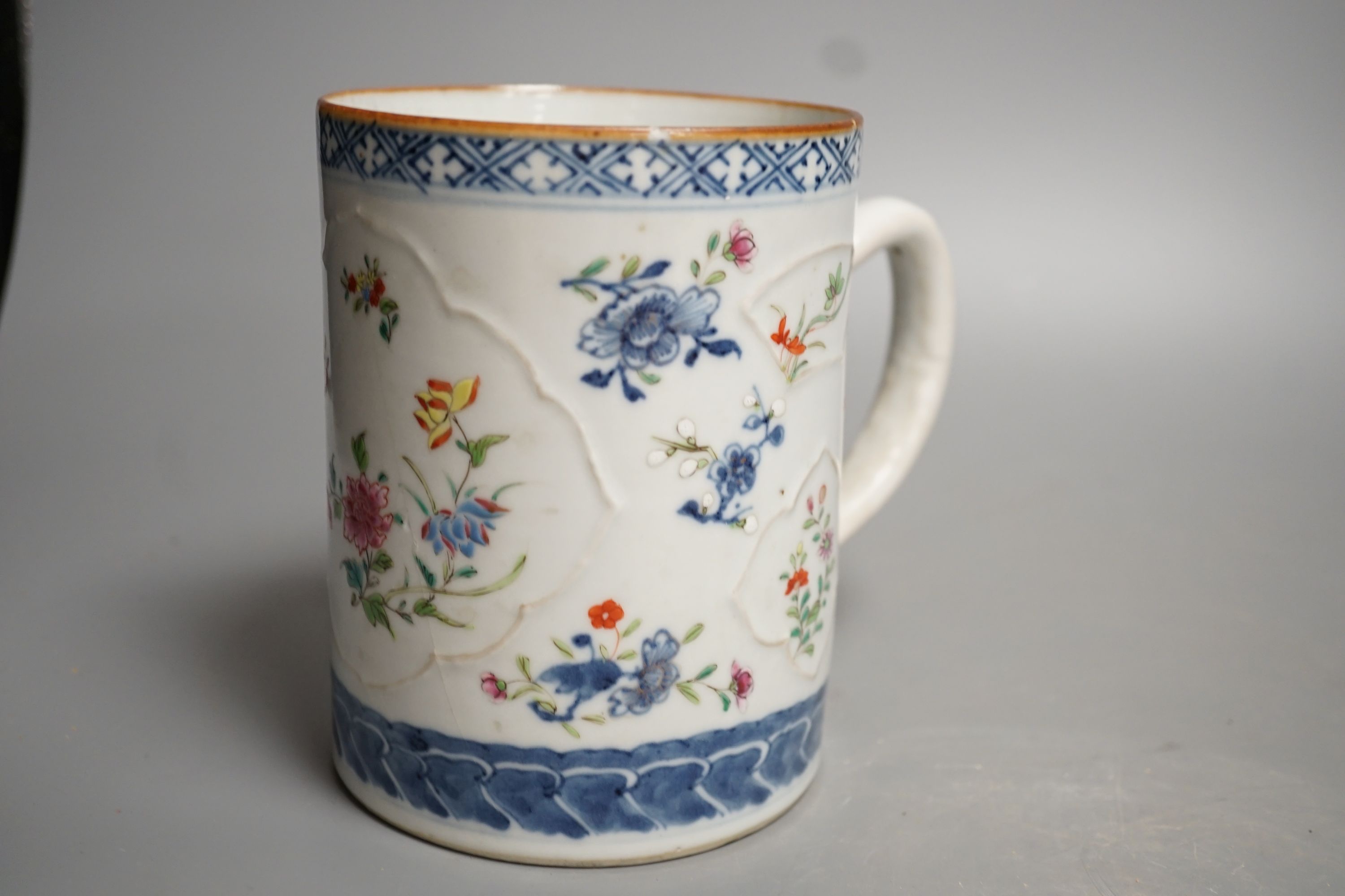 An 18th-century Chinese export mug, 15cm high, two similar plates, four 20th century Chinese dragon plates and a soapstone vase